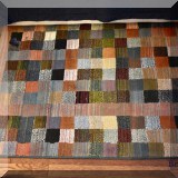 D19. Multicolred patchwork rug. 6' x 4' 